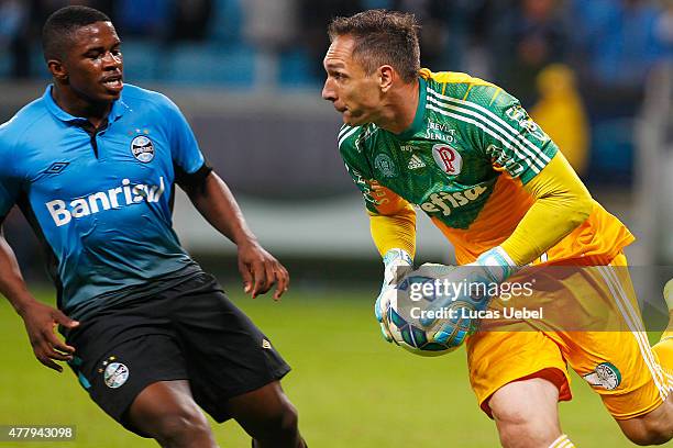 Yuri Mamute of Gremio battles for the ball against Fernando Prass of Palmeiras during the match Gremio v Palmeiras as part of Brasileirao Series A...