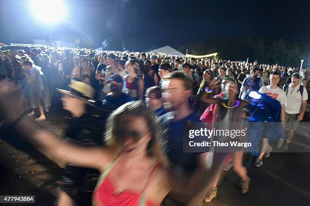 Guests evacuate the festival grounds on day 3 of the Firefly Music Festival on June 20, 2015 in Dover, Delaware.