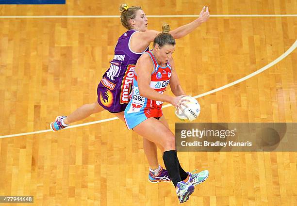 Kim Green of the Swifts and Gabi Simpson of the Firebirds compete for the ball during the 2015 ANZ Championship Grand Final match between the...