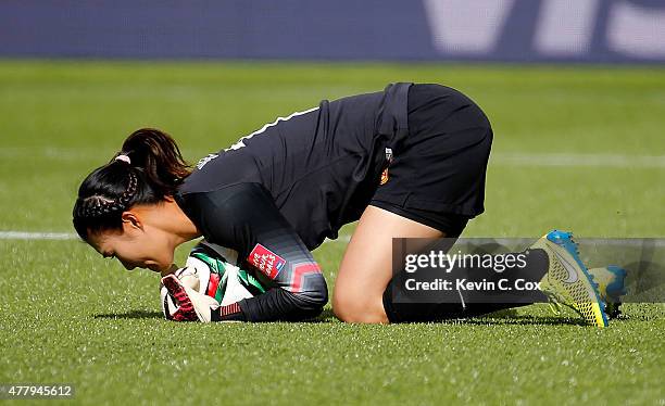 Goalkeeper Wang Fei of China PR makes a save against Cameroon during the FIFA Women's World Canada 2015 Round of 16 match between China PR and...