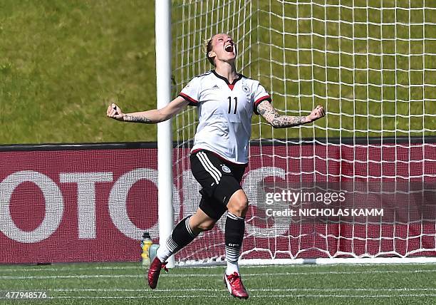 Germany's Anja Mittag celebrates scoring against Sweden during a 2015 FIFA Women's World Cup round of 16 match at Lansdowne Stadium in Ottawa on June...