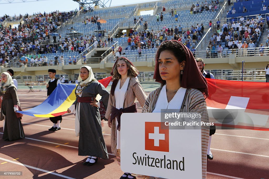 The flag of Switzerland is carried into the stadium by...