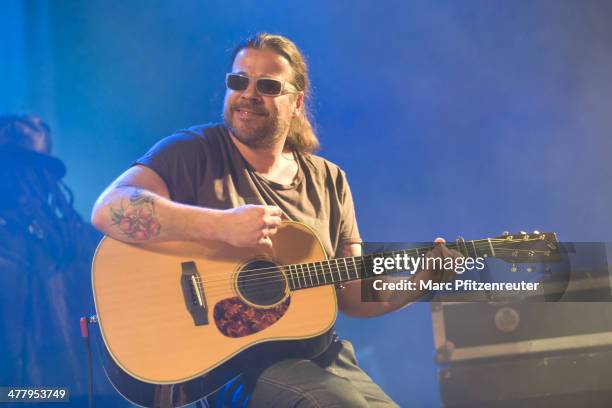 Guitarist Andreas Bayless of German pop and soul band Soehne Mannheims performs during their 'Wer fuehlen will, muss hoeren Tour', at the E-Werk on...