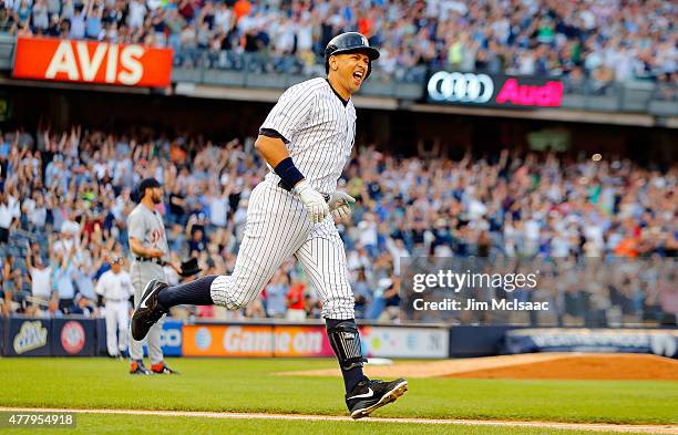 Alex Rodriguez of the New York Yankees celebrates as he runs the bases after his 3,000th career hit, a first inning home run, as Justin Verlander of...