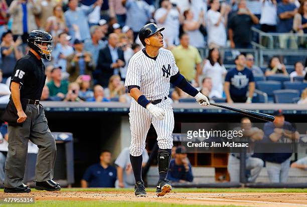 Alex Rodriguez of the New York Yankees follows through on his 3,000th career hit, a first inning home run, against the Detroit Tigers at Yankee...