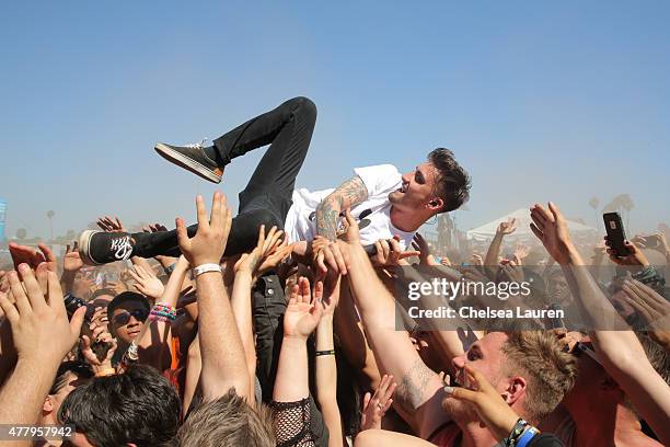 Vocalist Kyle Pavone of We Came as Romans performs during the Vans Warped Tour at Fairplex on June 19, 2015 in Pomona, California.