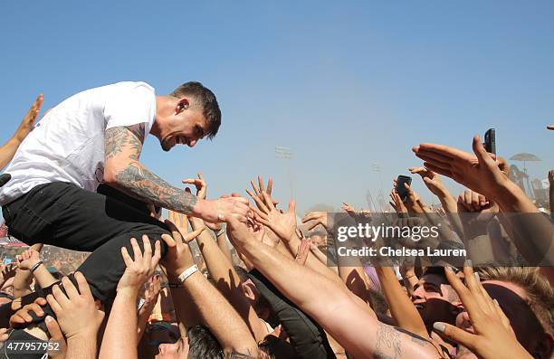 Vocalist Kyle Pavone of We Came as Romans performs during the Vans Warped Tour at Fairplex on June 19, 2015 in Pomona, California.