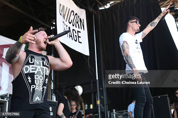 Vocalists Dave Stephens and Kyle Pavone of We Came as Romans perform during the Vans Warped Tour at Fairplex on June 19, 2015 in Pomona, California.