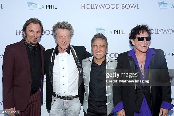 Musicians Jonathan Cain and Ross Valory, singer Arnel Pineda, and musician Neal Schon of Journey attend Hollywood Bowl Opening Night 2015 at the...