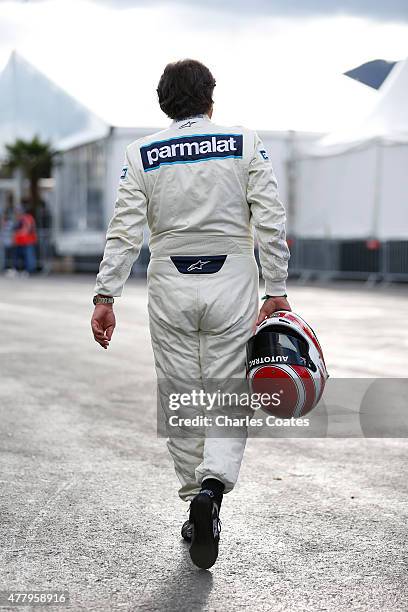 Former driver Nelson Piquet walks away from the track after qualifying for the Formula One Grand Prix of Austria at Red Bull Ring on June 20, 2015 in...