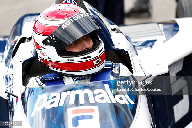 Former driver Nelson Piquet sits in his car before driving the track after qualifying for the Formula One Grand Prix of Austria at Red Bull Ring on...