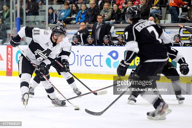 Marc-Olivier Roy of the Blainville-Boisbriand Armada stickhandles the puck in front of Jean-Simon Deslauriers of the Gatineau Olympiques during the...