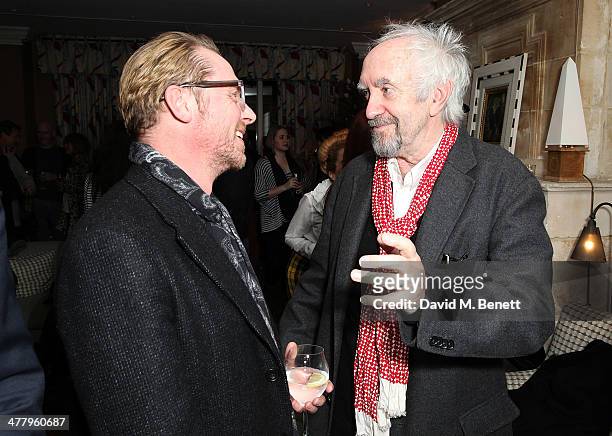 Simon Pegg and Jonathan Pryce attend a private screening of "The Zero Theorem" at the Charlotte Street Hotel on March 11, 2014 in London, England.