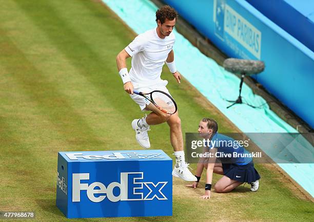 Andy Murray of Great Britain jumps in his men's singles semi-final match against Viktor Troicki of Serbia during day seven of the Aegon Championships...