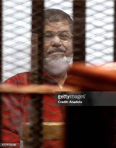 Former Egyptian President Mohamed Morsi, wearing a red uniform after Cairo Criminal Court on Tuesday sentenced him to death over a prison break in...