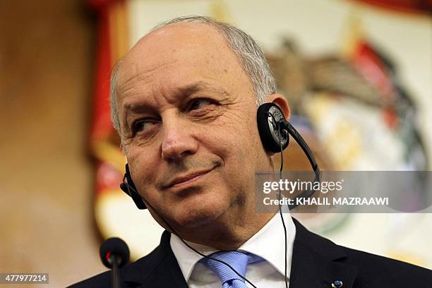 French Foreign Affairs minister Laurent Fabius looks on during a joint press conference with his Jordanian counterpart Nasser Judeh in the Jordanian...