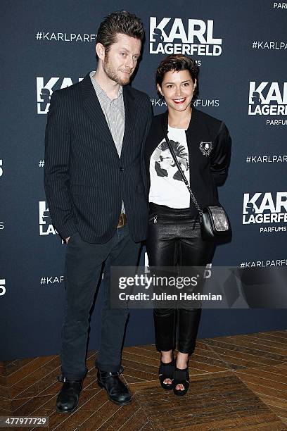 Emma de Caunes and her husband Jamie Hewlett attend the Karl Lagerfeld New Perfume launch party at Palais Brongniart on March 11, 2014 in Paris,...