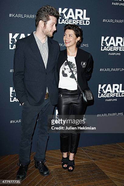 Emma de Caunes and her husband Jamie Hewlett attend the Karl Lagerfeld New Perfume launch party at Palais Brongniart on March 11, 2014 in Paris,...