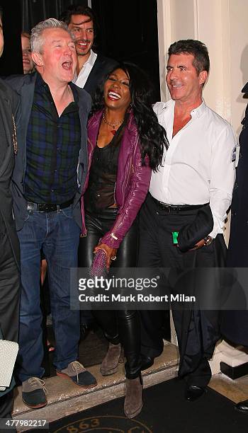 Louis Walsh, Sinitta and Simon Cowell at the Arts club on March 11, 2014 in London, England.