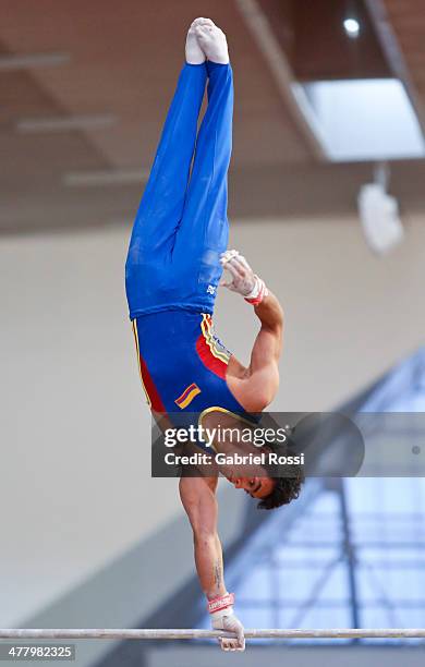 Jossimar Calvo of Colombia competes in the Mens High Bar during day five of the X South American Games Santiago 2014 at Gimnasio Polideportivo...