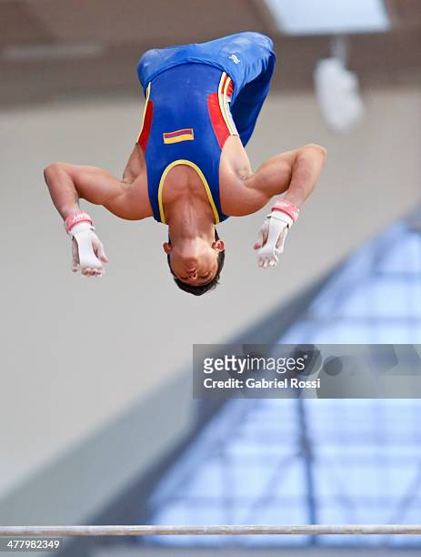 Jossimar Calvo of Colombia competes in the Mens High Bar during day five of the X South American Games Santiago 2014 at Gimnasio Polideportivo...