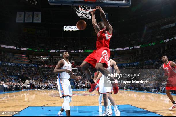 Terrence Jones of the Houston Rockets dunks the ball against the Oklahoma City Thunder during an NBA game on March 11, 2014 at the Chesapeake Energy...