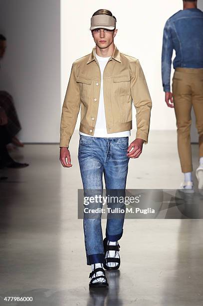 Model walks the runway during the Calvin Klein Collection fashion show as part of Milan Men's Fashion Week Spring/Summer 2016 on June 21, 2015 in...