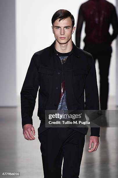 Model walks the runway during the Calvin Klein Collection fashion show as part of Milan Men's Fashion Week Spring/Summer 2016 on June 21, 2015 in...