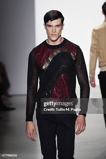 Model walks the runway during the Calvin Klein Collection fashion show as part of Milan Men's Fashion Week Spring/Summer 2016 on June 21, 2015 in...