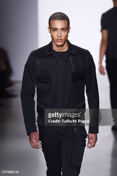 Model walks the runway during the Calvin Klein Collection fashion show as part of Milan Men's Fashion Week Spring/Summer 2016 on June 21, 2015 in...