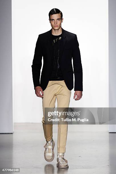 Model walks the runway during the Calvin Klein Collection fashion show as part of Milan Men's Fashion Week Spring/Summer 2016 on June 21, 2015 in...