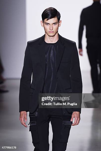 Model walks the runway during the Calvin Klein Collection fashion show as part of Milan Men's Fashion Week Spring/Summer 2016 on June 21, 2015 in...