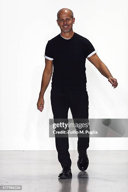 Designer Italo Zucchelli walks the runway after the Calvin Klein Collection show as part of Milan Men's Fashion Week Spring/Summer 2016 on June 21,...