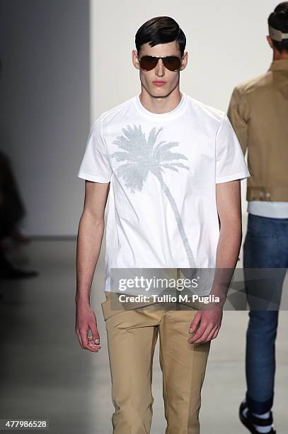 Model walks the runway during the Calvin Klein Collection fashion show as part of Milan Men's Fashion Week Spring/Summer 2016 on June 21, 2015 in...