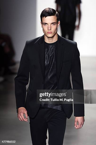 Model walks the runway during the Calvin Klein Collection fashion show as part of Milan Men's Fashion Week Spring/Summer 2016 on June 21, 2015 in...