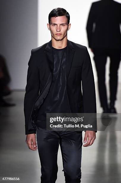 Model walks the runway during the Calvin Klein Collection fashion show as part of Milan Men's Fashion Week Spring/Summer 2016 on June 21, 2015 in...