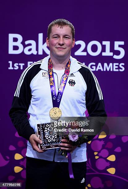 Gold medalist Christian Reitz of Germany poses with the medal won during the Men's Shooting 25m Rapid Fire Pistol on day nine of the Baku 2015...