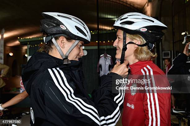 Annike Krahn and Saskia Bartusiak of Germany prepare to take a bike ride on June 21, 2015 in Ottawa, Canada.