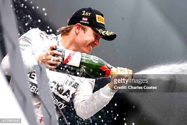 Nico Rosberg of Germany and Mercedes GP celebrates on the podium after winning the Formula One Grand Prix of Austria at Red Bull Ring on June 21,...