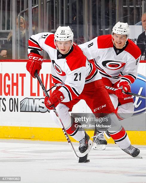 Drayson Bowman of the Carolina Hurricanes in action against the New Jersey Devils at the Prudential Center on March 8, 2014 in Newark, New Jersey....
