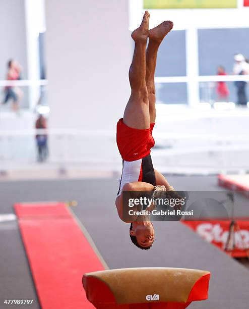 Mario Berrios of Peru competes in the Men's Vault during day five of the X South American Games Santiago 2014 at Gimnasio Polideportivo Estadio...