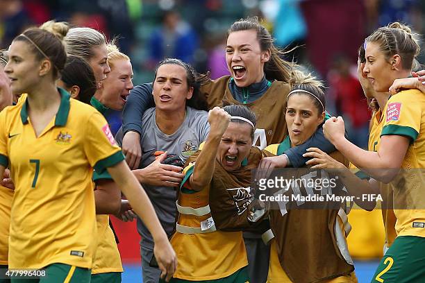 Australia celebrates, led by Lisa De Vanna of Australia, center, after their 1-1 tie against Sweden during the Women's World Cup 2015 Group D match...