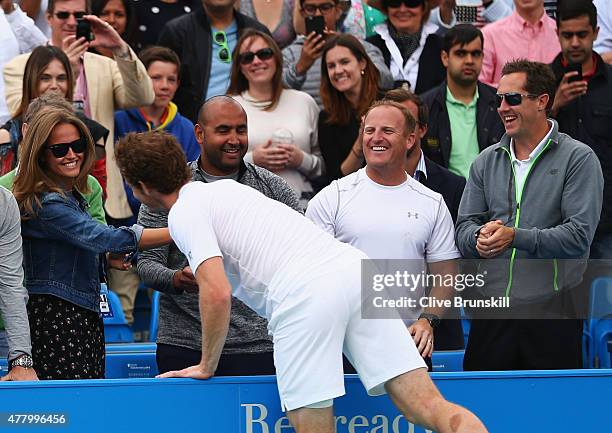 Andy Murray of Great Britain celebrates victory with wife Kim Murray as coach Jonas Bjorkman looks on after his men's singles final match against...