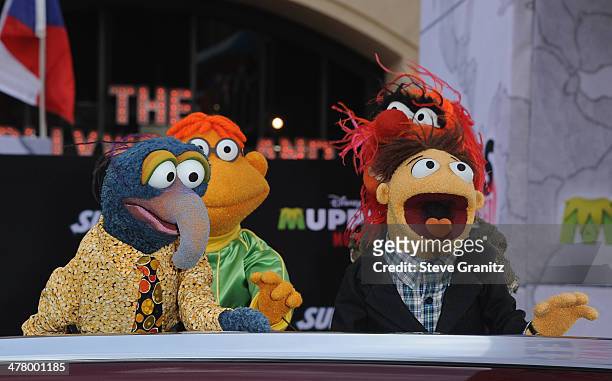 Muppet characters The Great Gonzo, Scooter, Walter and Animal arrive for Disney's "Muppets Most Wanted" Los Angeles Premiere at the El Capitan...