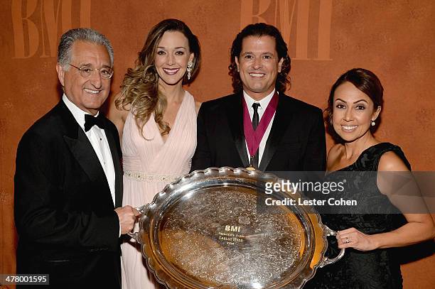 President Del Bryant, Elena Vives, 2014 BMI President's Award recipient Carlos Vives and BMI Vice President, Latin Writer/Publisher Relations Los...