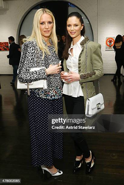 Marchesa designers Keren Craig and Georgina Chapman attend "Vs./Better" Charity Art Exhibition opening reception at Dillon Gallery on March 11, 2014...