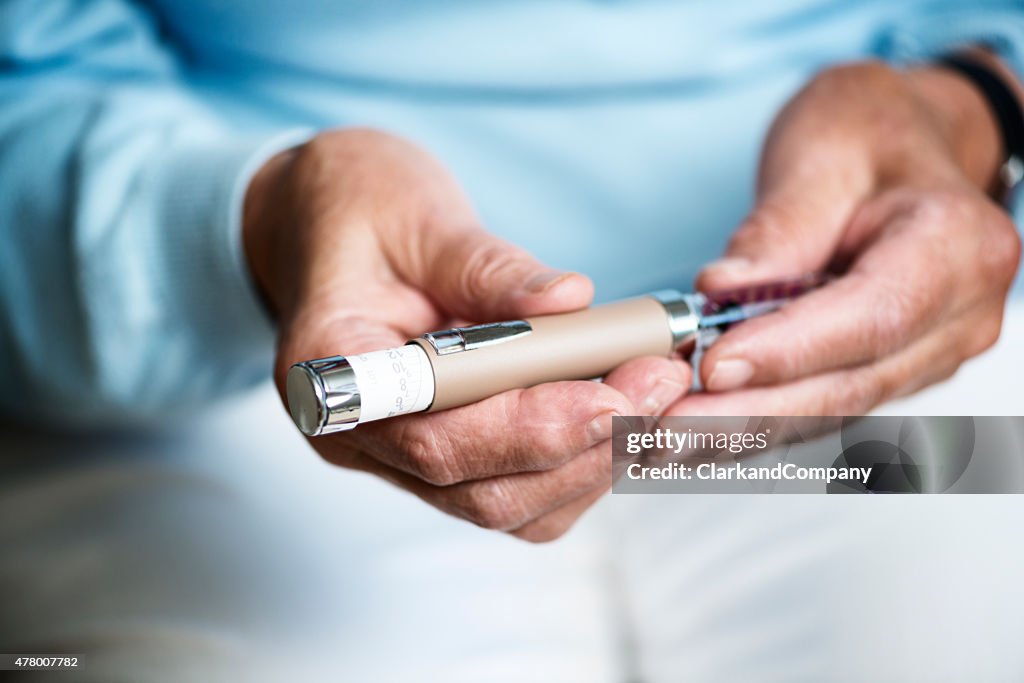 Senior Woman Checking Her Insulin Dosage.