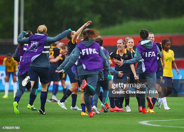 Australia players celebrate victory after the FIFA Women's World Cup 2015 round of 16 match between Brazil and Australia at Moncton Stadium on June...