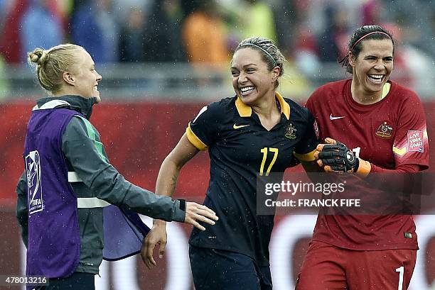 Australia's forward Kyah Simon and Australia's goalkeeper Lydia Williams celebrates his victory against Brazil during their 2015 FIFA Women's World...