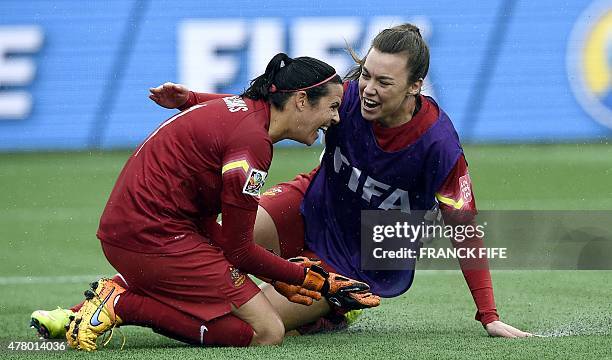 Australia's goalkeepers Lydia Williams and Melissa Barbier celebrate a victory against Brazil during their 2015 FIFA Women's World Cup round of 16...